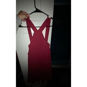 Red dress, cross straps across chest